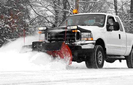 Pickup Truck With Snowplow Plowing Parking Area